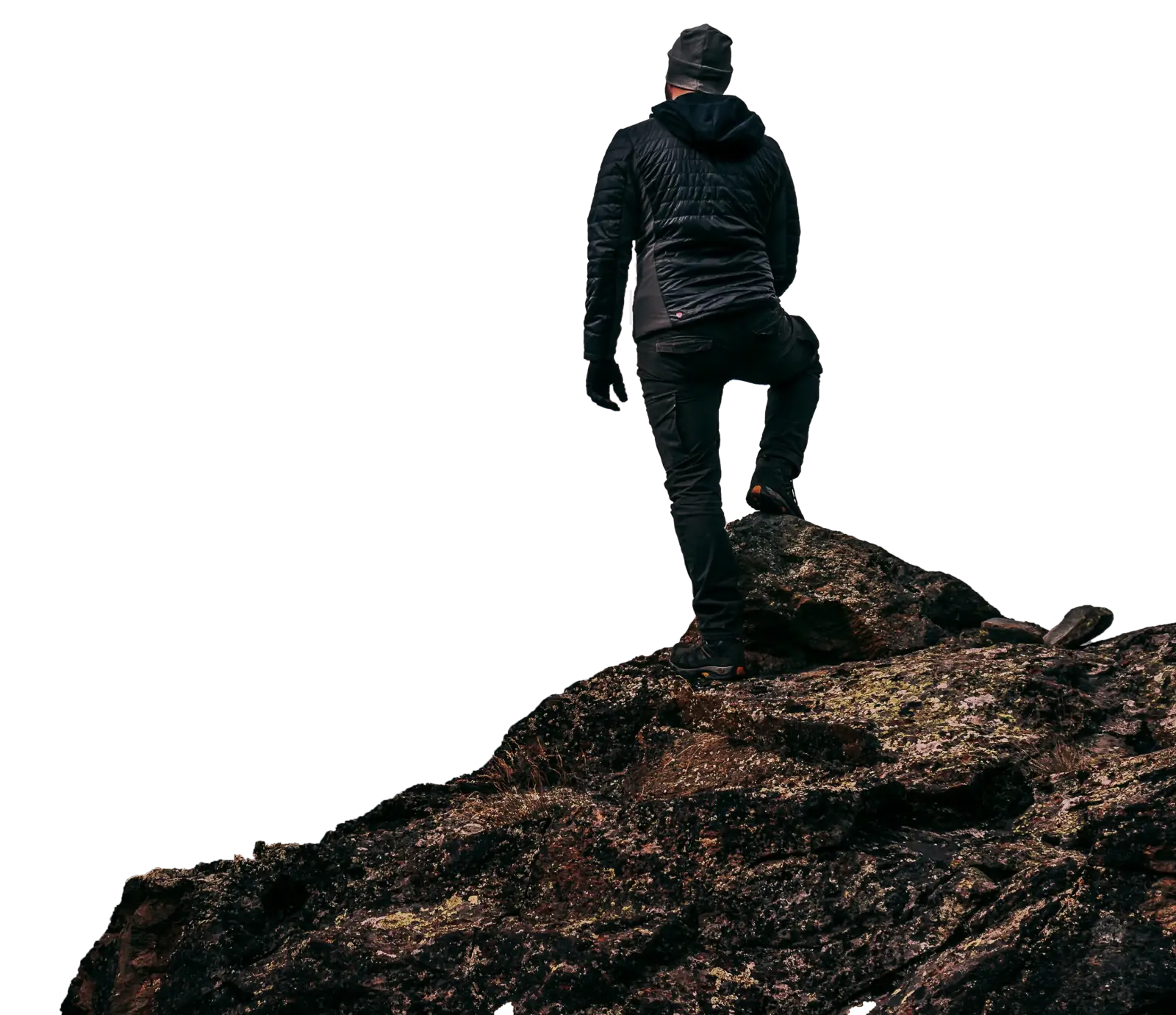 Traveler with backpack standing on mountain peak enjoying Kashmir views